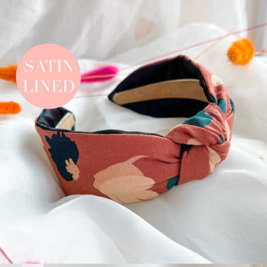 Brown floral Liberty London knot headband for women, comfortable and flexible fabric hairband, featuring a floral design, is the perfect ladies hair accessory, combining the style of a knotted hairband with the practicality of a wide headband for a chic and secure look.